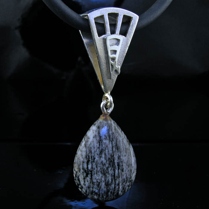 photo of fan shaped protective pendant